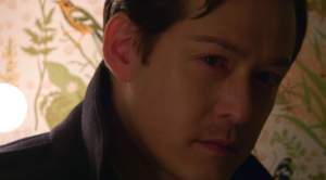 Traveling Man, played by Chris Min, moved to tears by the story of Compline