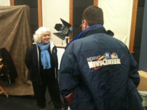 Director Lauralee Farrer interviewed by Indiana news while filming Compline